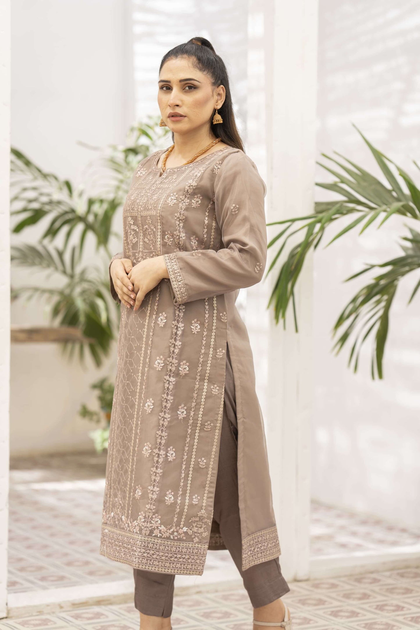 Woman wearing a brown traditional outfit