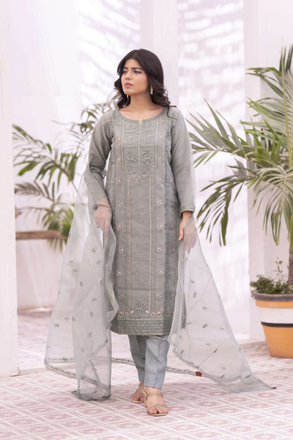 Woman wearing a light green traditional outfit with a light dupatta
