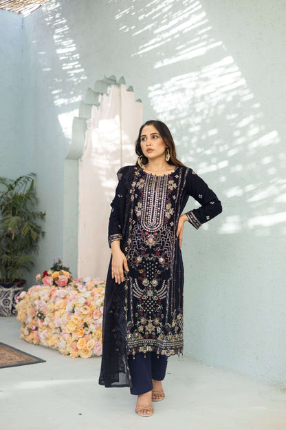 Woman in a dark blue chiffon embroidered dress 